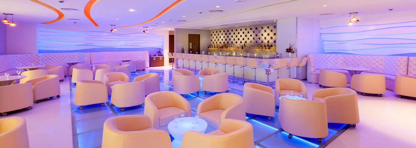 Luxury modern lounge interior with elegant seating, ambient lighting, and a stylish bar area in Pune
